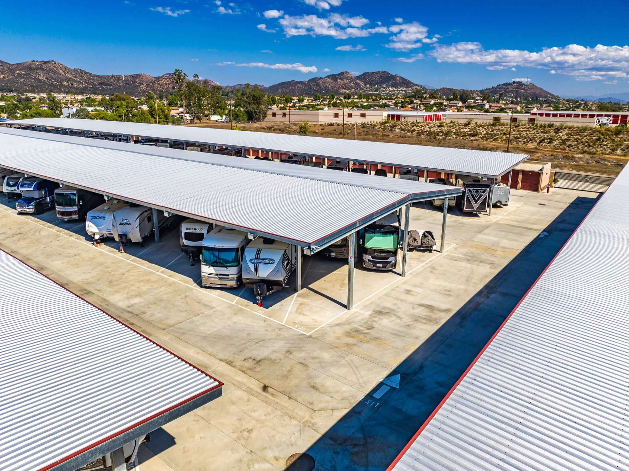 aerial view of vehicles parked under cover at self storage facility